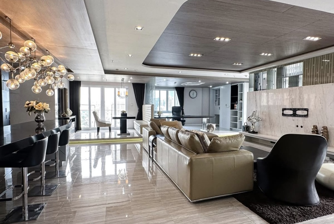 Luxury 3-bedroom penthouse for rent near BTS Asoke, 240 sqm with large walk-in closet, modern kitchen, office space, city view balconies, and premium facilities. 150,000 THB/month.