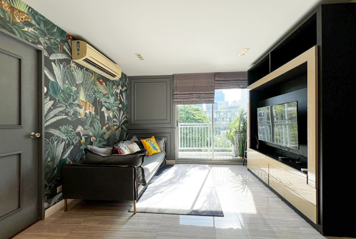 Stylish 2-bedroom condo for rent on Sukhumvit Soi 51 near BTS Thonglor. 80 sqm, peaceful location with green views, designer interiors, walk to EmQuartier & cafes. 48,000 THB/month.