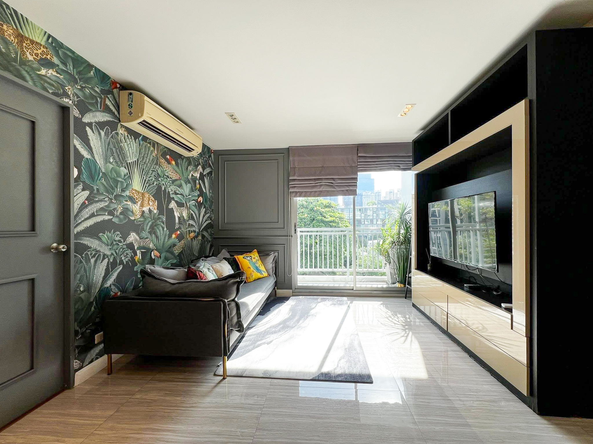 Stylish 2-bedroom condo for rent on Sukhumvit Soi 51 near BTS Thonglor. 80 sqm, peaceful location with green views, designer interiors, walk to EmQuartier & cafes. 48,000 THB/month.