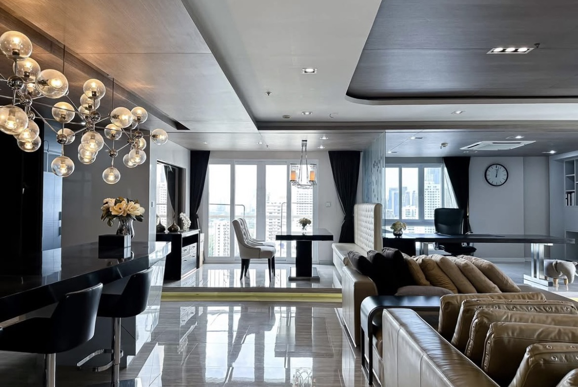 Luxury 3-bedroom penthouse for rent near BTS Asoke, 240 sqm with large walk-in closet, modern kitchen, office space, city view balconies, and premium facilities. 150,000 THB/month.