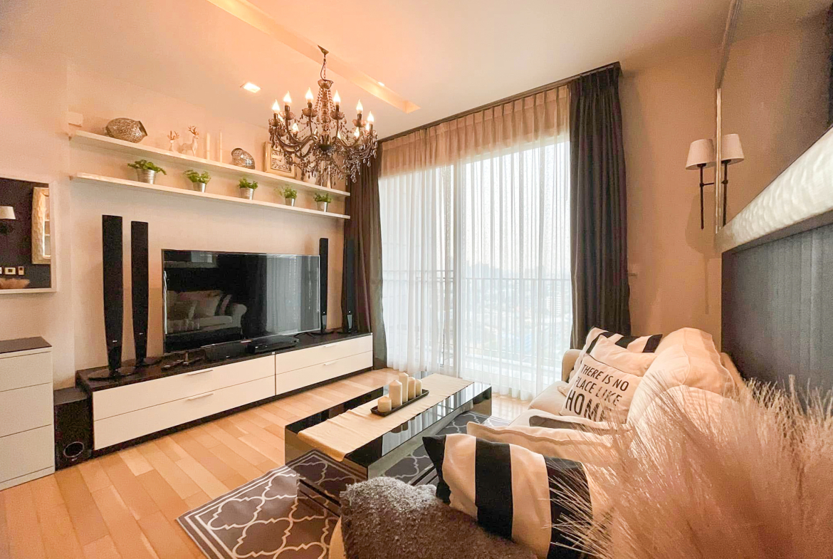 Luxury 2-bedroom condo at SIRI at Sukhumvit for rent and sale. Just 2 minutes walk to BTS Thong Lor. 24th floor with pool view, fully furnished, modern design. Rent 65,000 THB/month or buy for 15.5M THB.