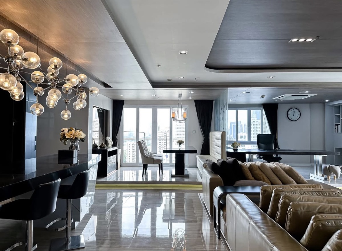 Luxury 3-bedroom penthouse for rent near BTS Asoke, 240 sqm with large walk-in closet, modern kitchen, office space, city view balconies, and premium facilities. 150,000 THB/month.