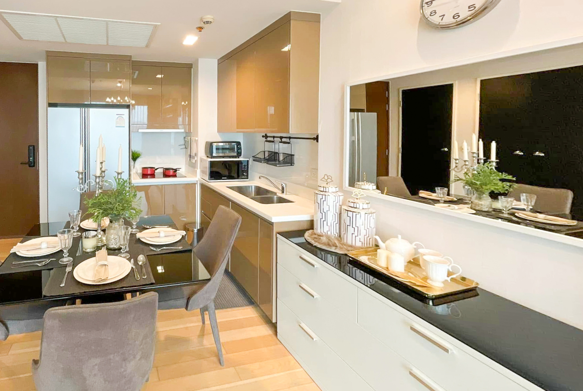 Luxury 2-bedroom condo at SIRI at Sukhumvit for rent and sale. Just 2 minutes walk to BTS Thong Lor. 24th floor with pool view, fully furnished, modern design. Rent 65,000 THB/month or buy for 15.5M THB.
