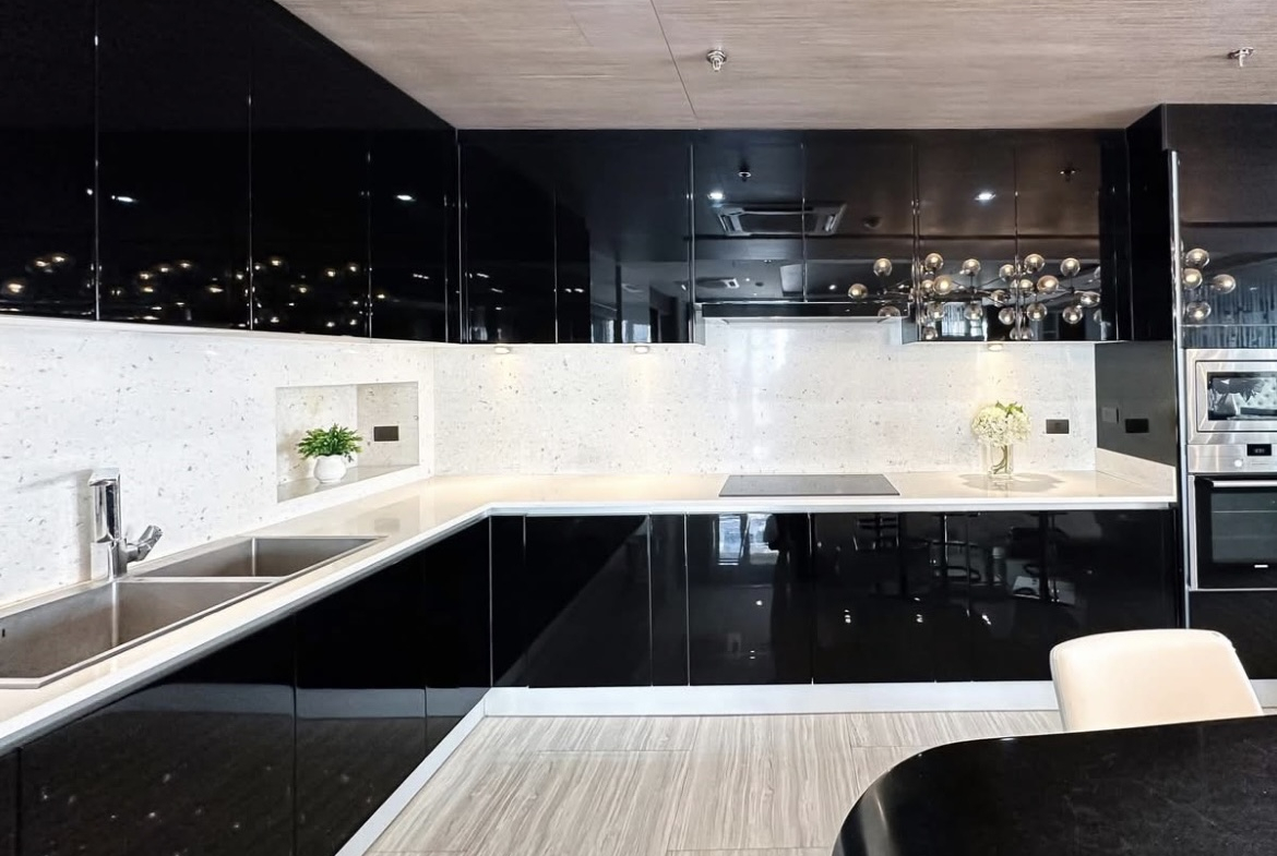 Luxury 3-bedroom penthouse for rent near BTS Asoke, 240 sqm with large walk-in closet, modern kitchen, office space, city view balconies, and premium facilities. 150,000 THB/month.
