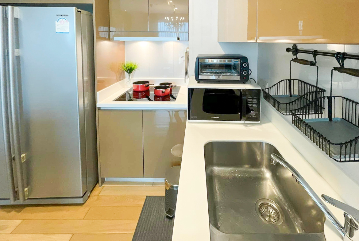 Luxury 2-bedroom condo at SIRI at Sukhumvit for rent and sale. Just 2 minutes walk to BTS Thong Lor. 24th floor with pool view, fully furnished, modern design. Rent 65,000 THB/month or buy for 15.5M THB.