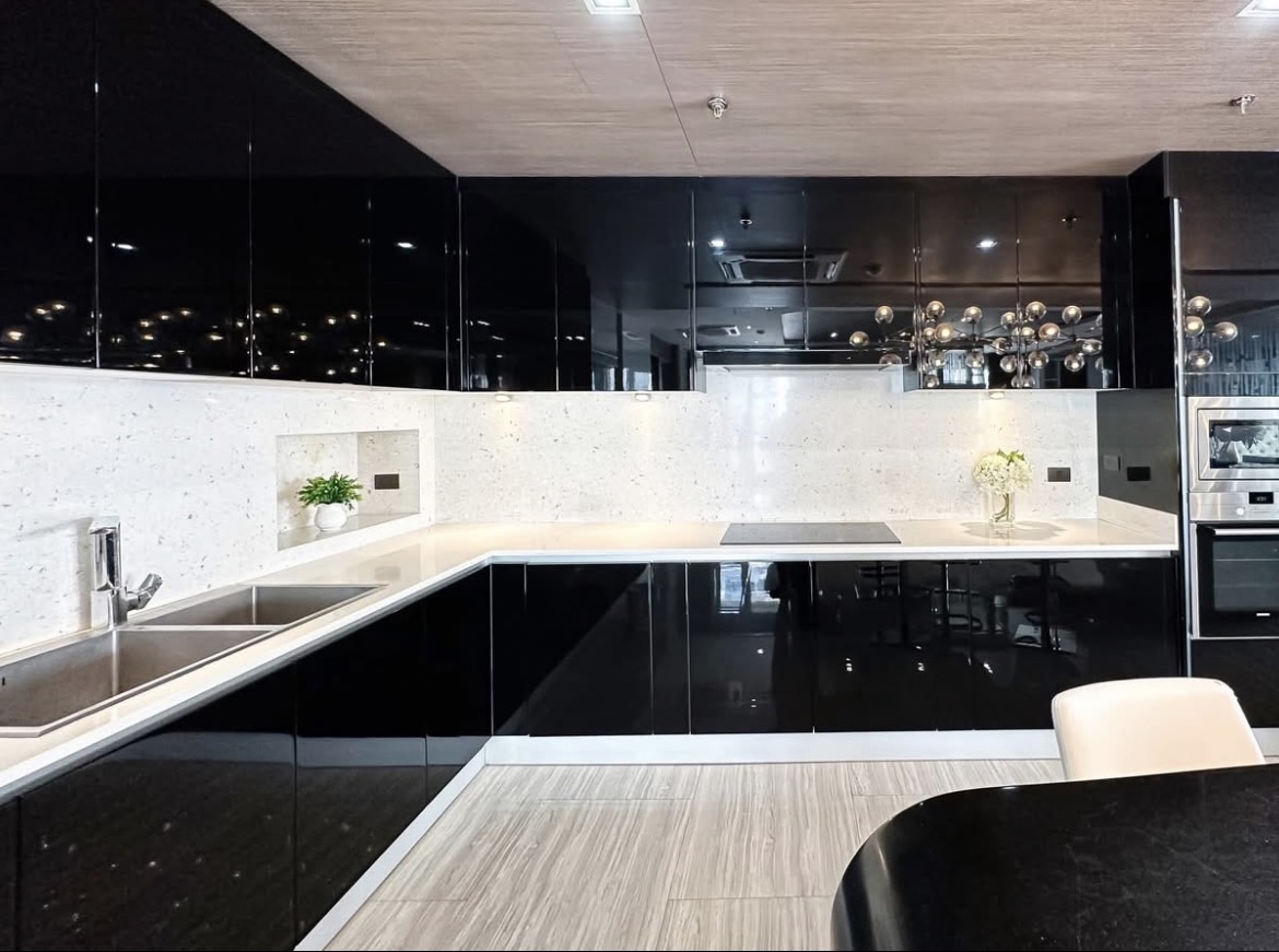 Luxury 3-bedroom penthouse for rent near BTS Asoke, 240 sqm with large walk-in closet, modern kitchen, office space, city view balconies, and premium facilities. 150,000 THB/month.