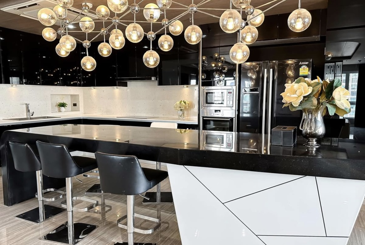 Luxury 3-bedroom penthouse for rent near BTS Asoke, 240 sqm with large walk-in closet, modern kitchen, office space, city view balconies, and premium facilities. 150,000 THB/month.