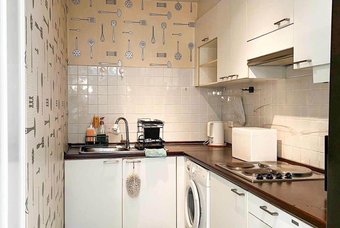 Stylish 2-bedroom condo for rent on Sukhumvit Soi 51 near BTS Thonglor. 80 sqm, peaceful location with green views, designer interiors, walk to EmQuartier & cafes. 48,000 THB/month.