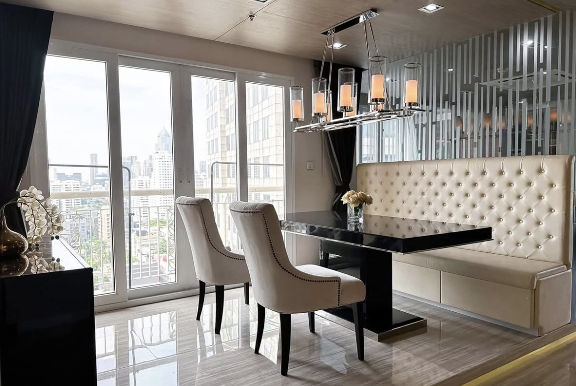 Luxury 3-bedroom penthouse for rent near BTS Asoke, 240 sqm with large walk-in closet, modern kitchen, office space, city view balconies, and premium facilities. 150,000 THB/month.