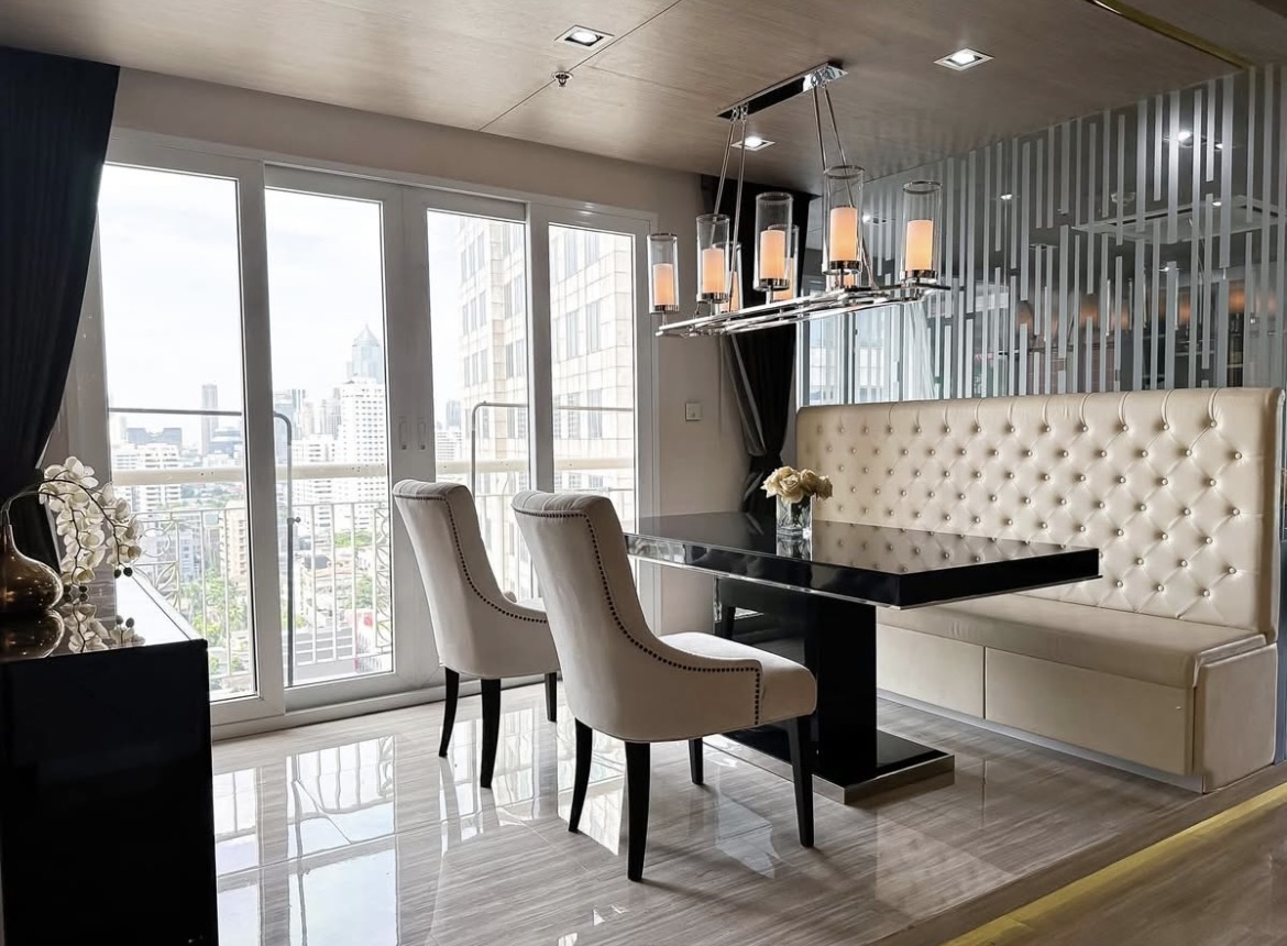 Luxury 3-bedroom penthouse for rent near BTS Asoke, 240 sqm with large walk-in closet, modern kitchen, office space, city view balconies, and premium facilities. 150,000 THB/month.