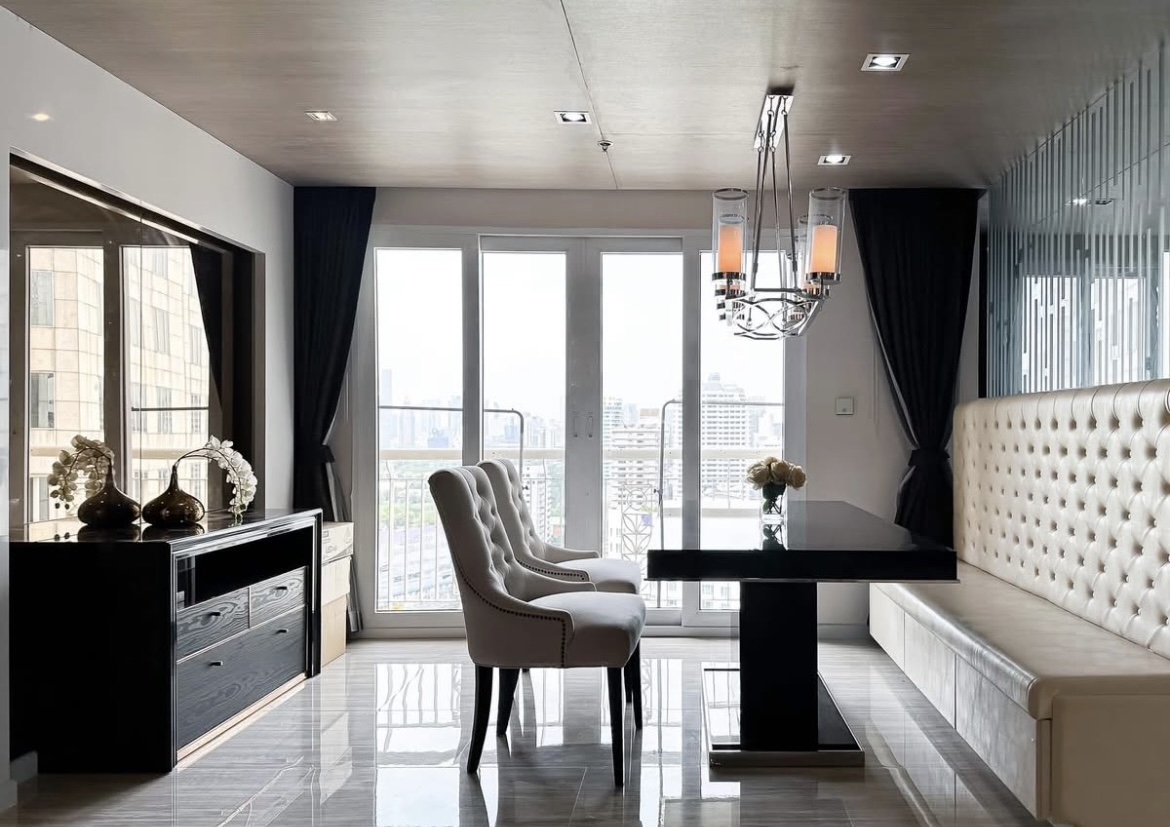 Luxury 3-bedroom penthouse for rent near BTS Asoke, 240 sqm with large walk-in closet, modern kitchen, office space, city view balconies, and premium facilities. 150,000 THB/month.