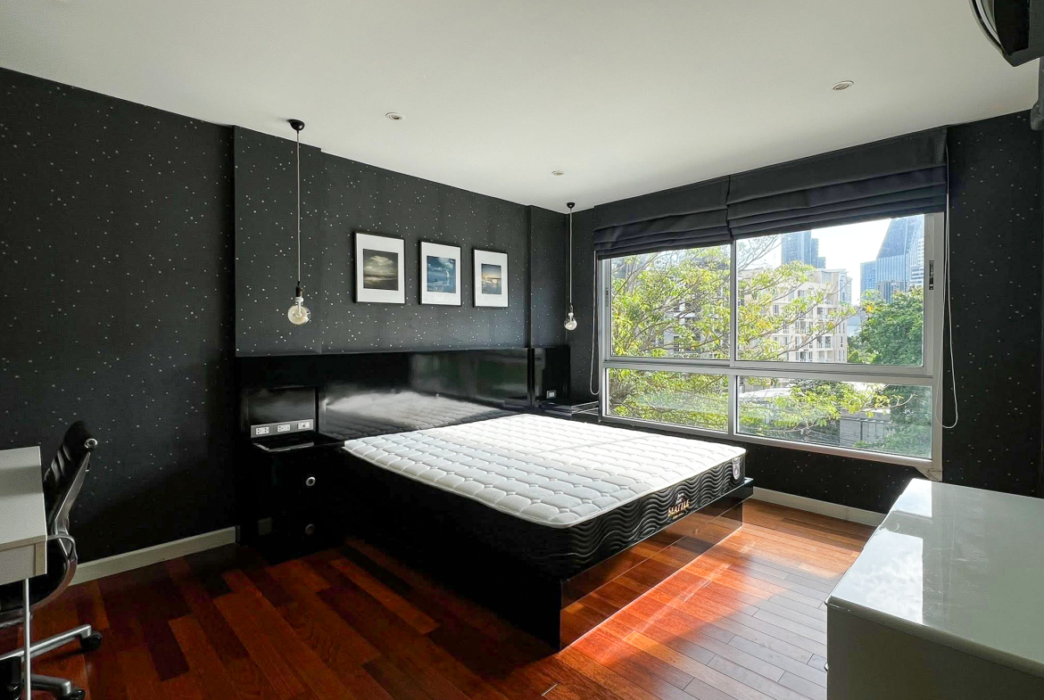 Stylish 2-bedroom condo for rent on Sukhumvit Soi 51 near BTS Thonglor. 80 sqm, peaceful location with green views, designer interiors, walk to EmQuartier & cafes. 48,000 THB/month.