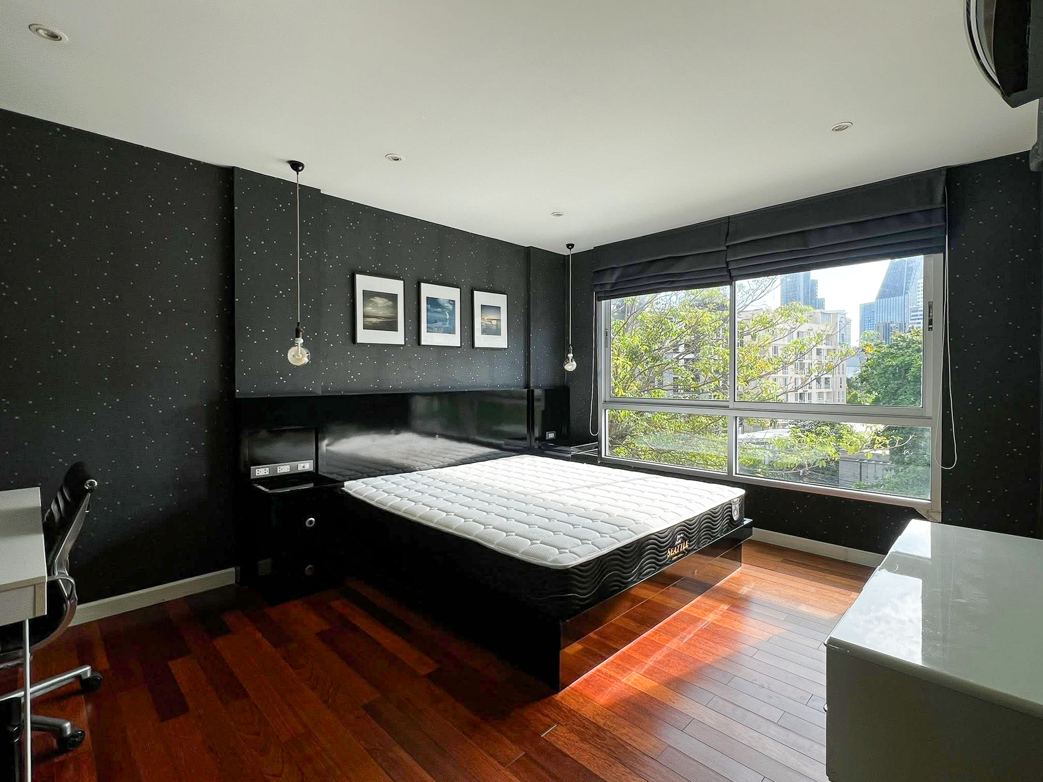 Stylish 2-bedroom condo for rent on Sukhumvit Soi 51 near BTS Thonglor. 80 sqm, peaceful location with green views, designer interiors, walk to EmQuartier & cafes. 48,000 THB/month.