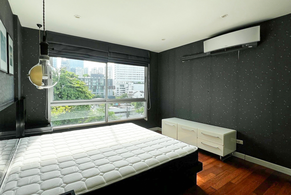 Stylish 2-bedroom condo for rent on Sukhumvit Soi 51 near BTS Thonglor. 80 sqm, peaceful location with green views, designer interiors, walk to EmQuartier & cafes. 48,000 THB/month.