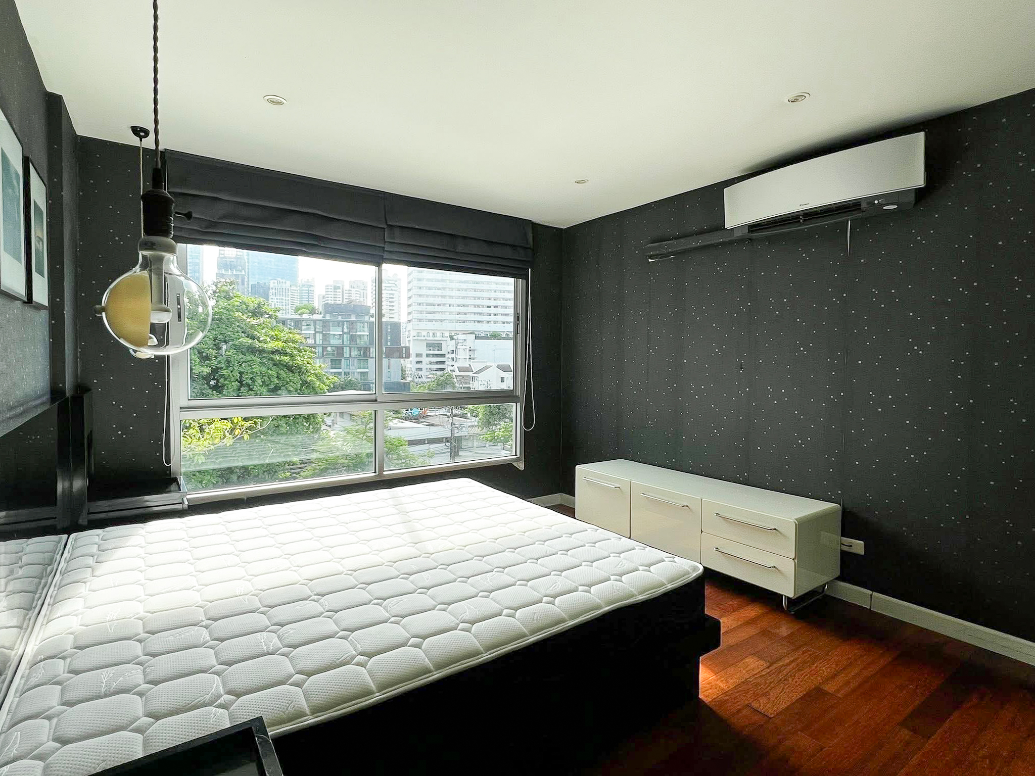 Stylish 2-bedroom condo for rent on Sukhumvit Soi 51 near BTS Thonglor. 80 sqm, peaceful location with green views, designer interiors, walk to EmQuartier & cafes. 48,000 THB/month.