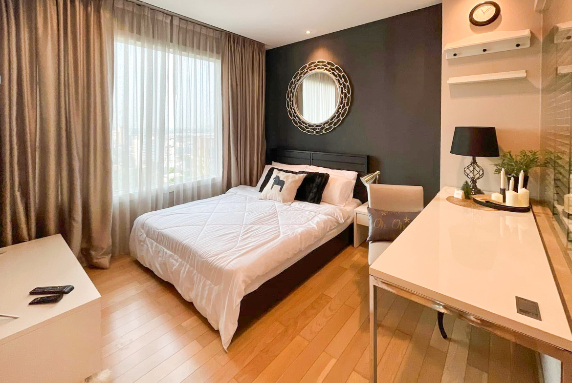 Luxury 2-bedroom condo at SIRI at Sukhumvit for rent and sale. Just 2 minutes walk to BTS Thong Lor. 24th floor with pool view, fully furnished, modern design. Rent 65,000 THB/month or buy for 15.5M THB.