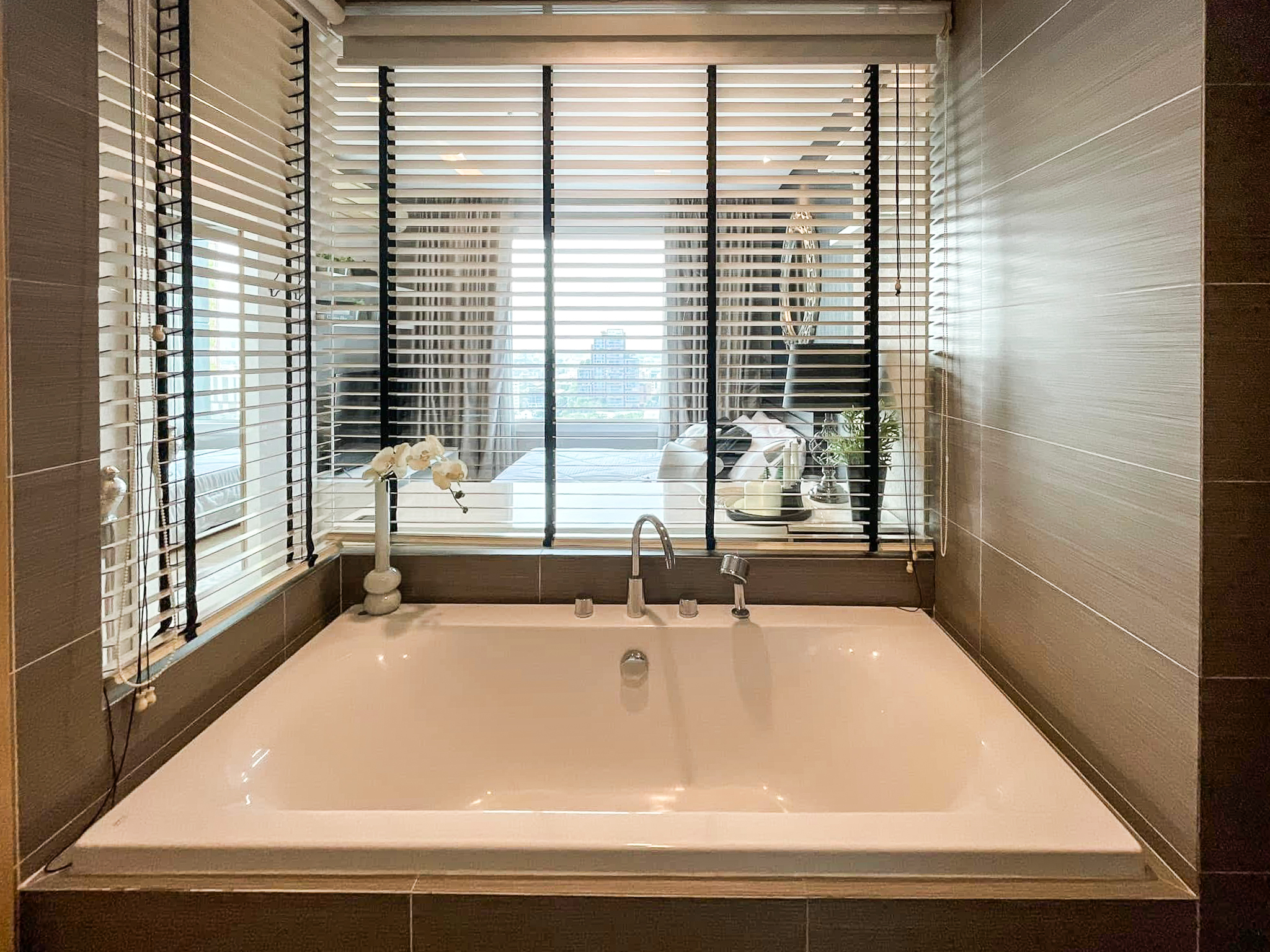 Luxury 2-bedroom condo at SIRI at Sukhumvit for rent and sale. Just 2 minutes walk to BTS Thong Lor. 24th floor with pool view, fully furnished, modern design. Rent 65,000 THB/month or buy for 15.5M THB.