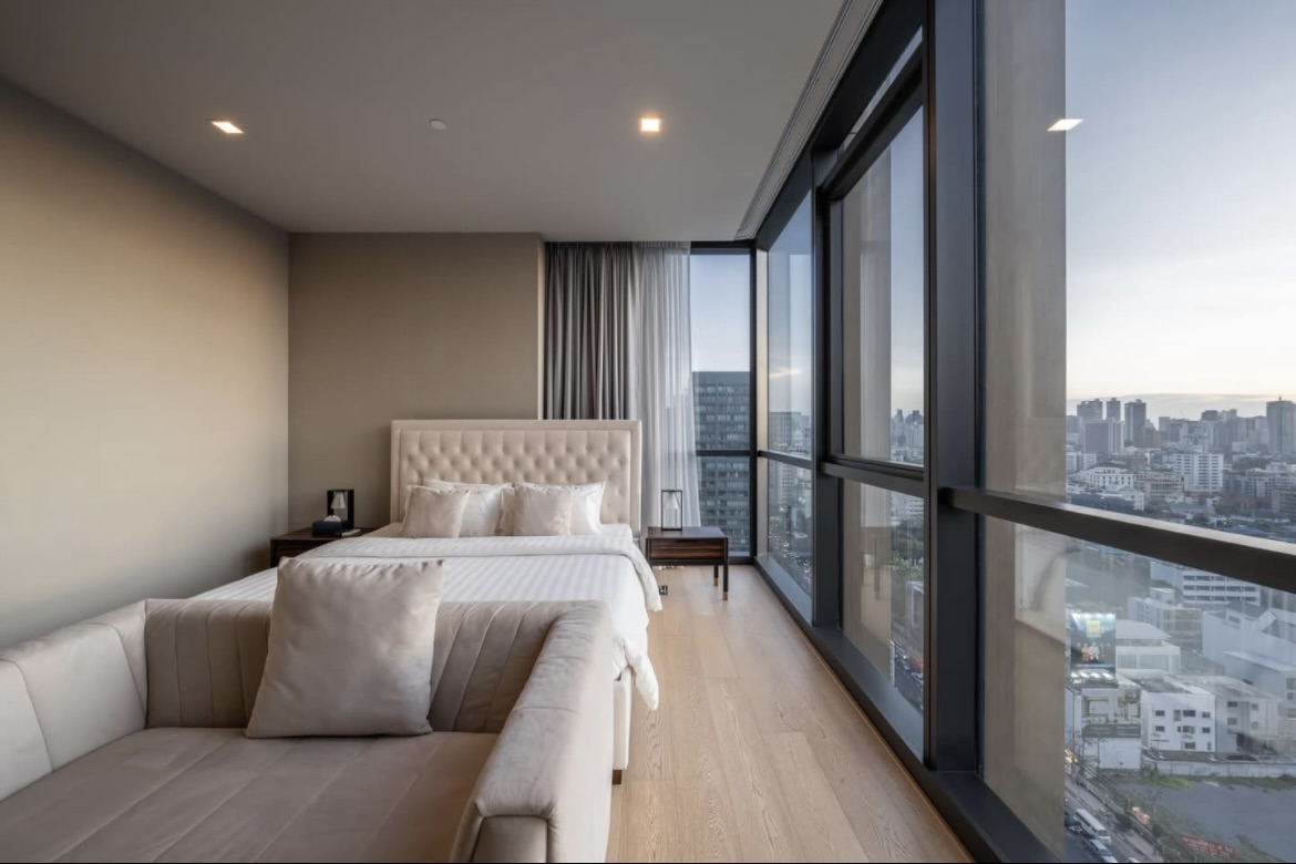 Luxury 2-bedroom condo for sale at The Monument Thonglor, best-positioned unit on the 18th floor with panoramic views, private lift, 2 parking rights, and pet-friendly. Fully furnished. 33.9M THB.
