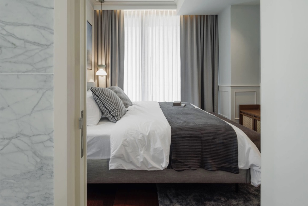 Ultra-luxury 2-bedroom condo for sale and rent at Khun by Yoo Thonglor 12. Fully furnished, newly decorated, 82 sqm with premium amenities, smart home features, and stunning east-facing city views.