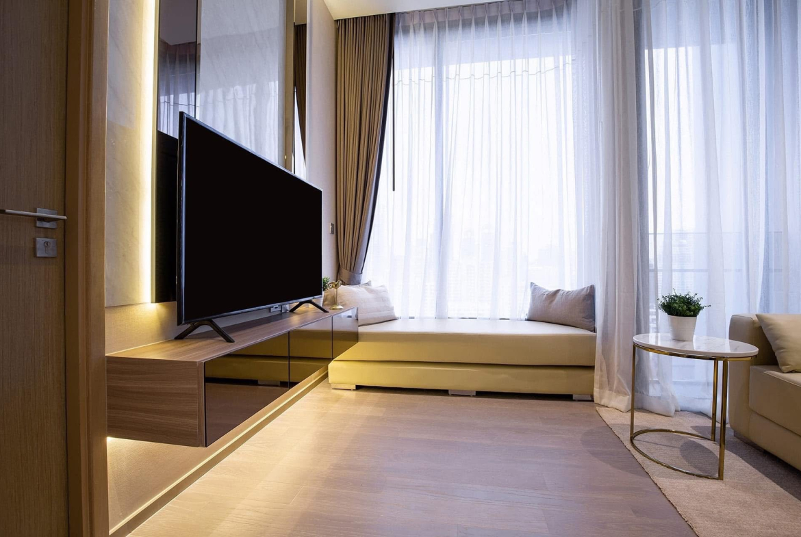 Luxury 1-bedroom condo for rent at The ESSE Asoke, fully furnished with clear city view. Prime location near BTS Asoke. High-end facilities. 47.5 sqm, 47,000 THB/month.