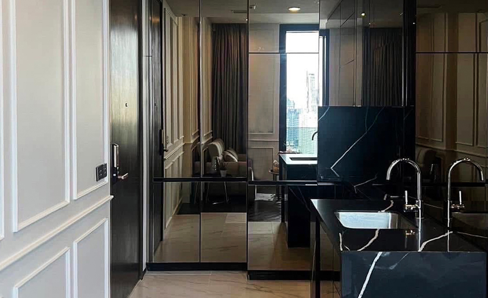 Modern 1-bedroom condo for rent at The Esse Sukhumvit 36, next to BTS Thong Lo. 38.14 sqm, high floor, home automation, sky lounge, onsen, pool & more. Rent only 45,000 THB/month.