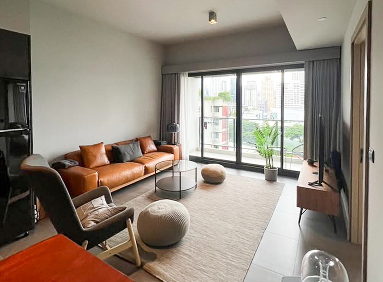 Modern 2-bedroom condo for rent at The Loft Asoke, 87 sqm, fully furnished, quiet city view, 8th floor. Includes kitchen, washer-dryer, 2 TVs. Rent 75,000 THB/month.