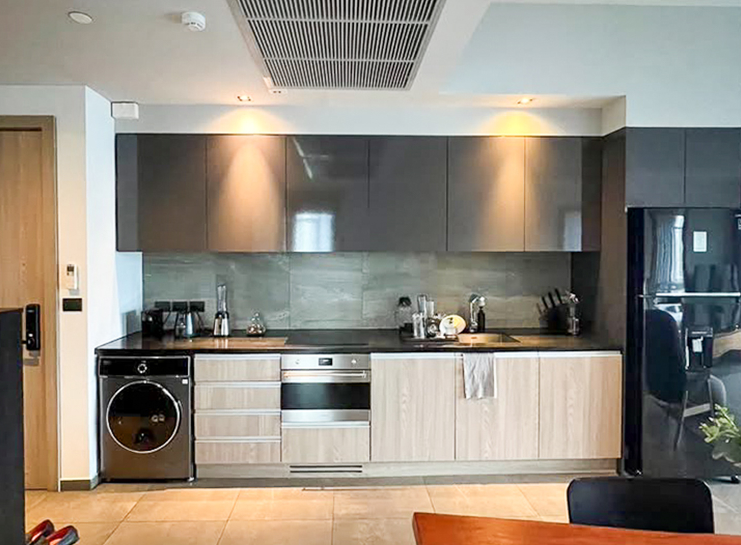 Modern 2-bedroom condo for rent at The Loft Asoke, 87 sqm, fully furnished, quiet city view, 8th floor. Includes kitchen, washer-dryer, 2 TVs. Rent 75,000 THB/month.