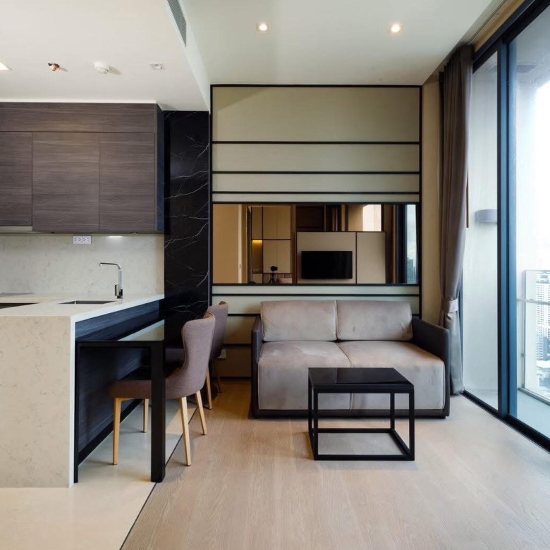 Rent this luxury 1-bedroom condo at The Esse Asoke, 32nd floor with skyline views, built-in furniture, and prime MRT/BTS access. Only 40,000 THB/month.