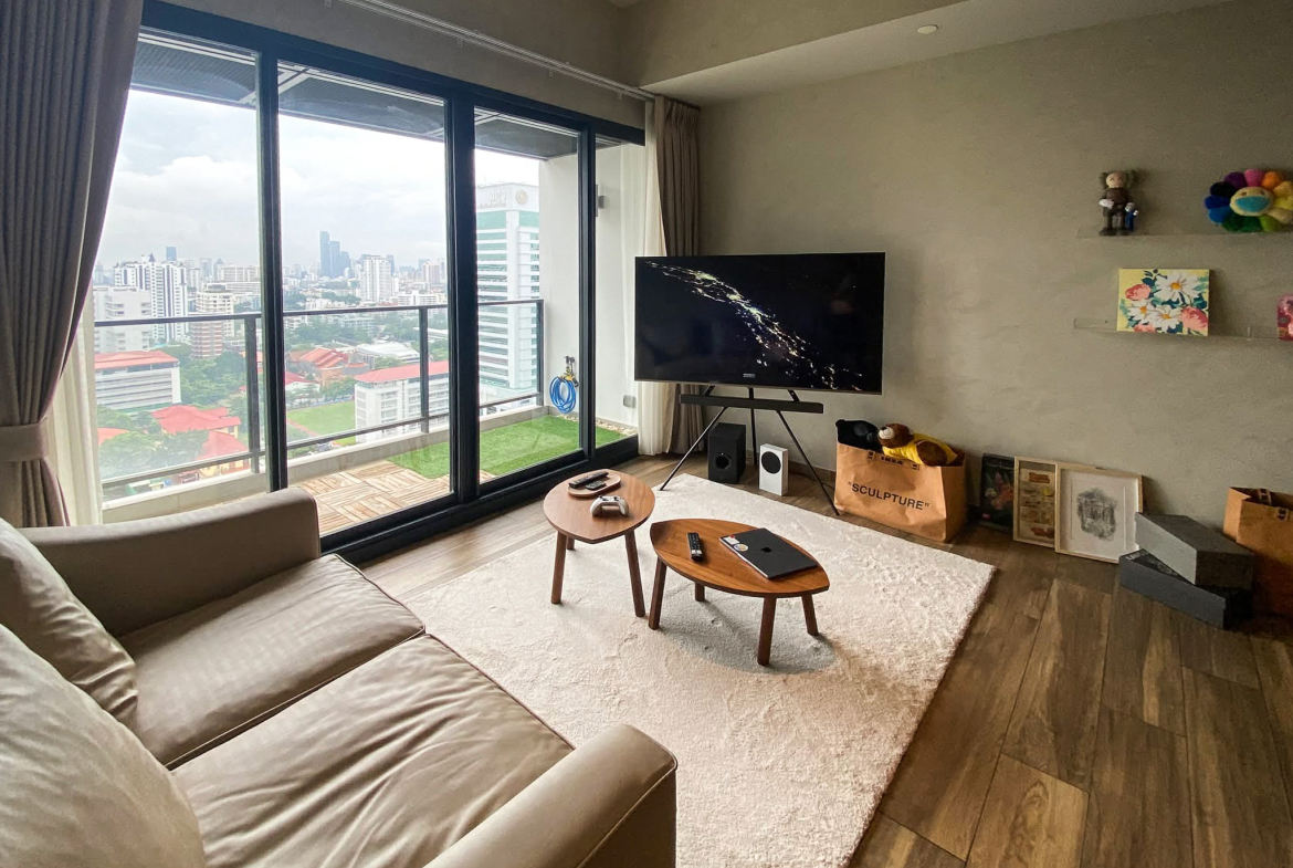 Rent this high-floor 2-bedroom condo at The Lofts Asoke with stunning city views, premium appliances, and luxury amenities. Prime Asoke location. 65,000 THB/month.
