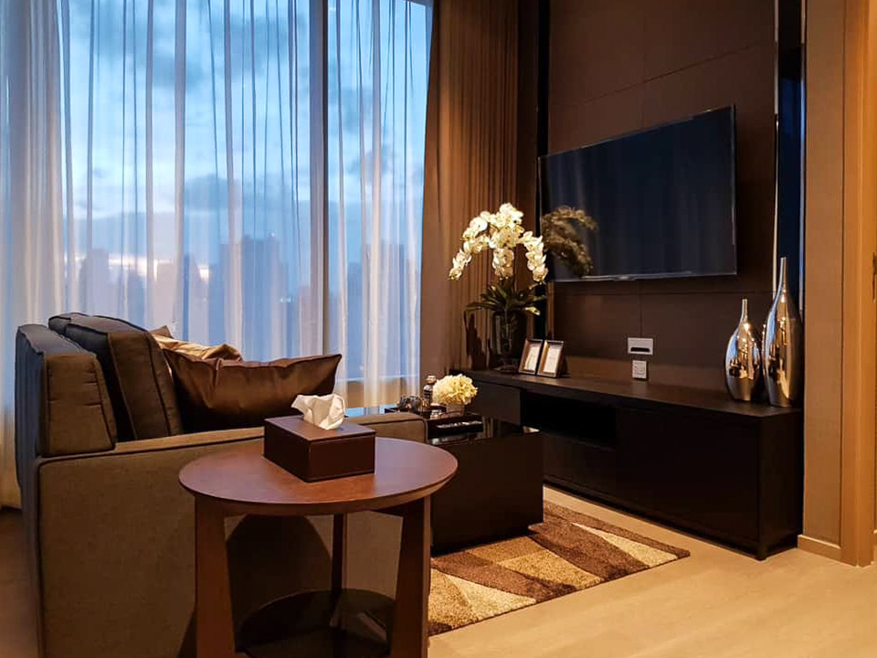 Luxury high-floor 2-bedroom condo for rent at The ESSE Asoke. Fully furnished with skyline views, top facilities, and prime Asoke location. Rent 70,000 THB/month.