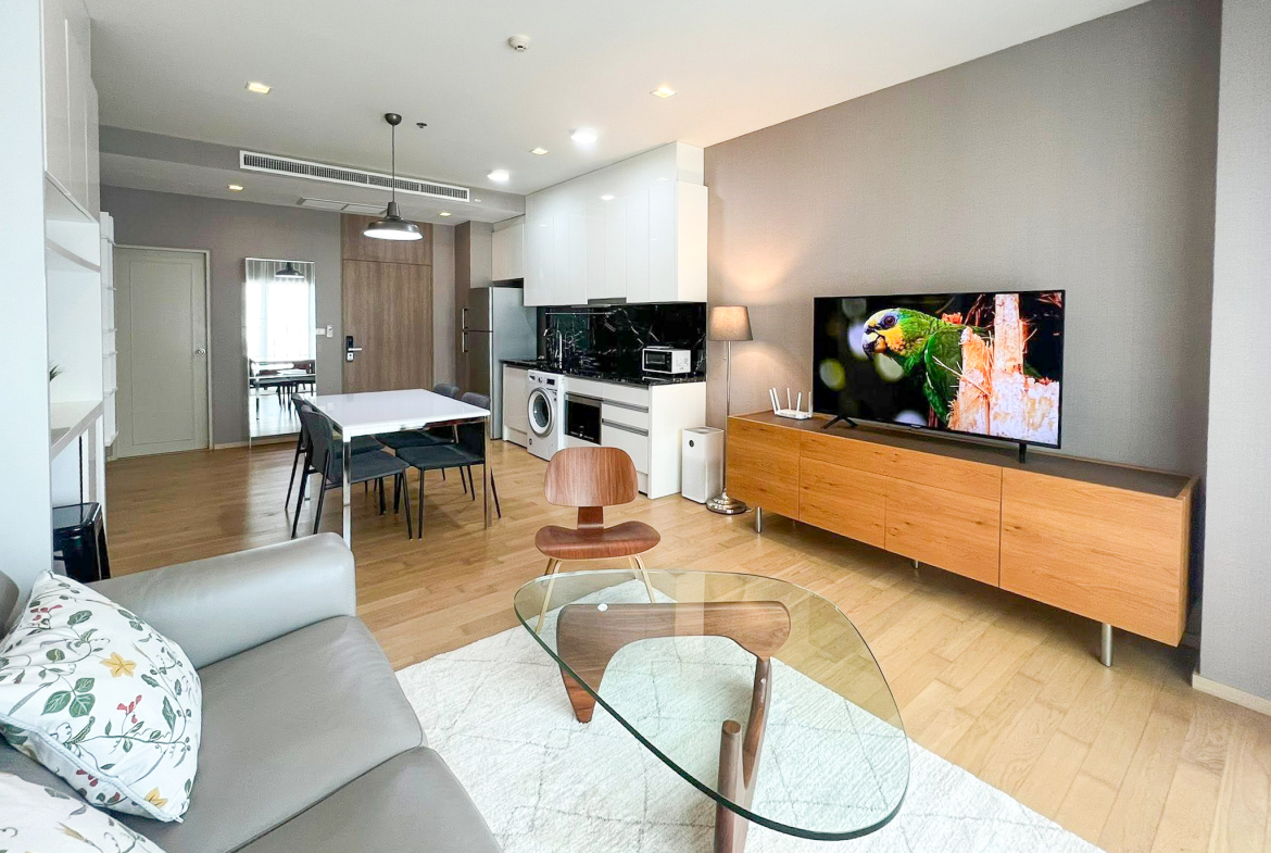 Spacious 2-bedroom, 2-bathroom condo for rent at Noble Reveal Ekkamai. Only 300m from BTS, fully furnished, 75 sqm, with indoor pool and gym. Rent: 60,000 THB/month.