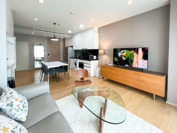Spacious 2-bedroom, 2-bathroom condo for rent at Noble Reveal Ekkamai. Only 300m from BTS, fully furnished, 75 sqm, with indoor pool and gym. Rent: 60,000 THB/month.