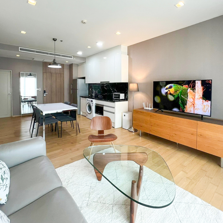 Spacious 2-bedroom, 2-bathroom condo for rent at Noble Reveal Ekkamai. Only 300m from BTS, fully furnished, 75 sqm, with indoor pool and gym. Rent: 60,000 THB/month.
