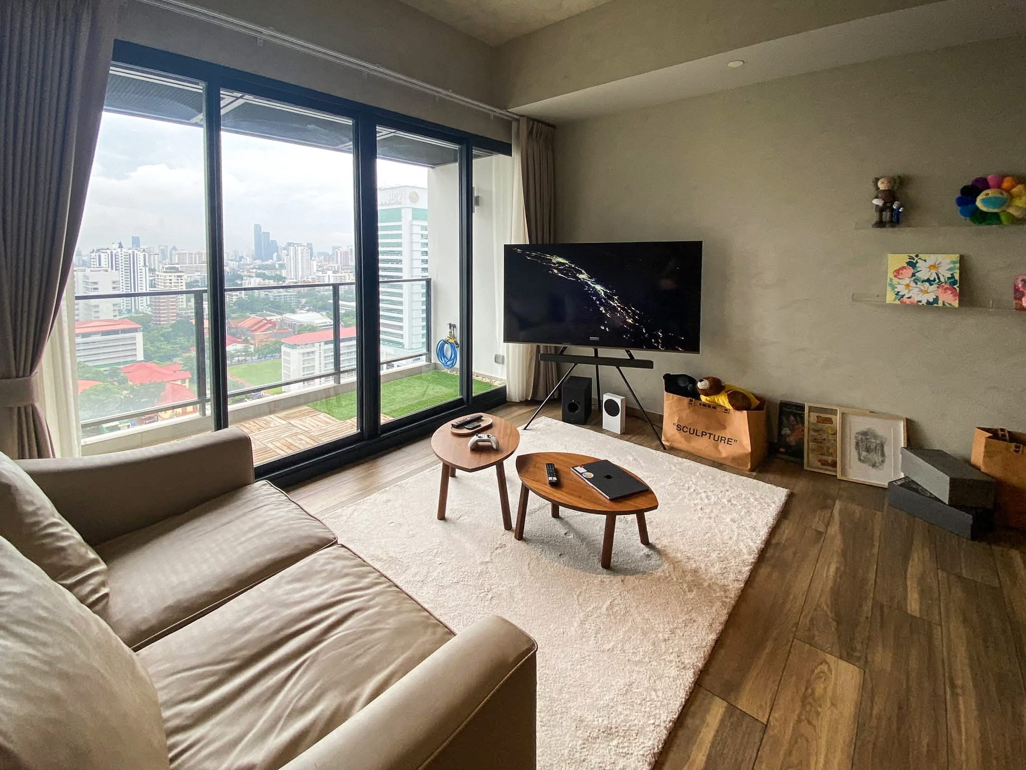 Rent this high-floor 2-bedroom condo at The Lofts Asoke with stunning city views, premium appliances, and luxury amenities. Prime Asoke location. 65,000 THB/month.