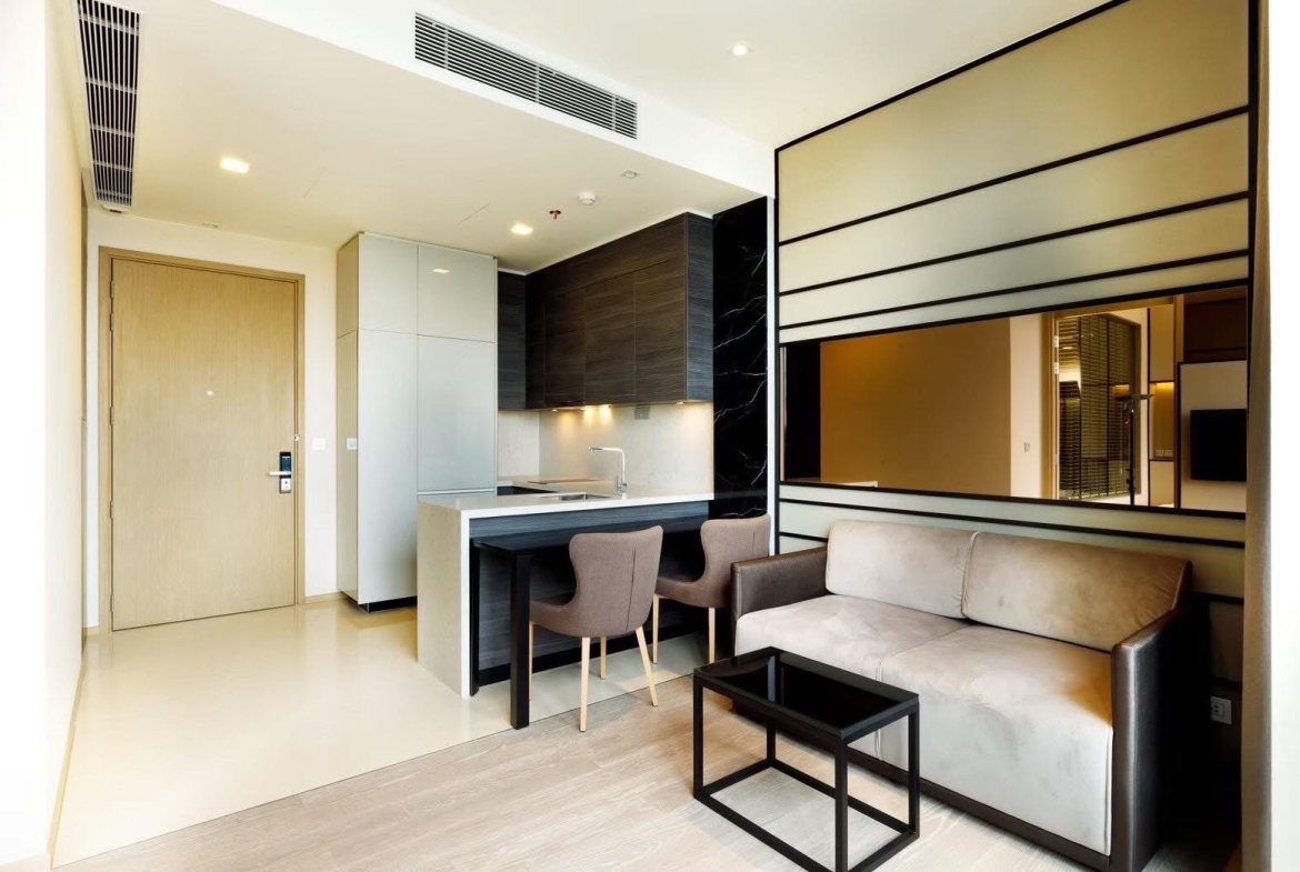 Rent this luxury 1-bedroom condo at The Esse Asoke, 32nd floor with skyline views, built-in furniture, and prime MRT/BTS access. Only 40,000 THB/month.