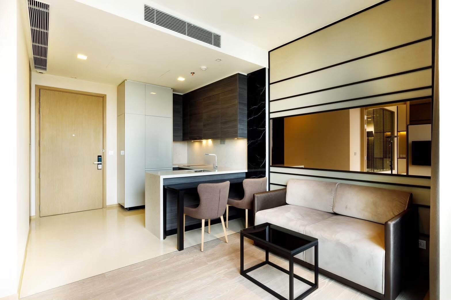 Rent this luxury 1-bedroom condo at The Esse Asoke, 32nd floor with skyline views, built-in furniture, and prime MRT/BTS access. Only 40,000 THB/month.