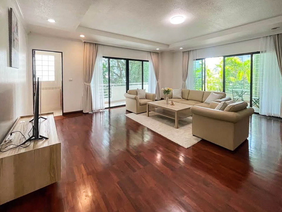 Pet-friendly 3 bed, 3 bath apartment for rent in Thong Lor. 280 sqm with balcony, maid room, full facilities, and greenery views. 120,000 THB/month.