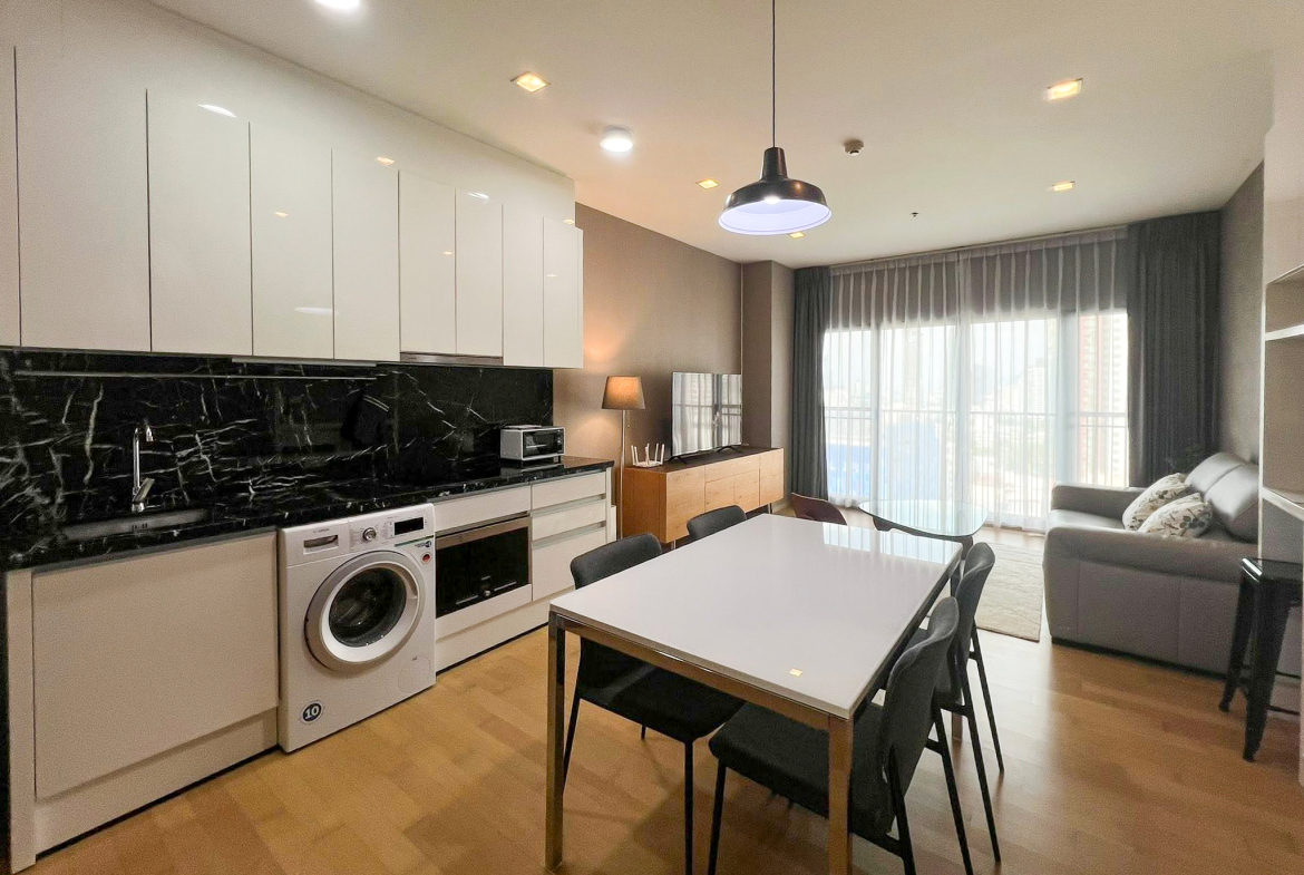 Spacious 2-bedroom, 2-bathroom condo for rent at Noble Reveal Ekkamai. Only 300m from BTS, fully furnished, 75 sqm, with indoor pool and gym. Rent: 60,000 THB/month.