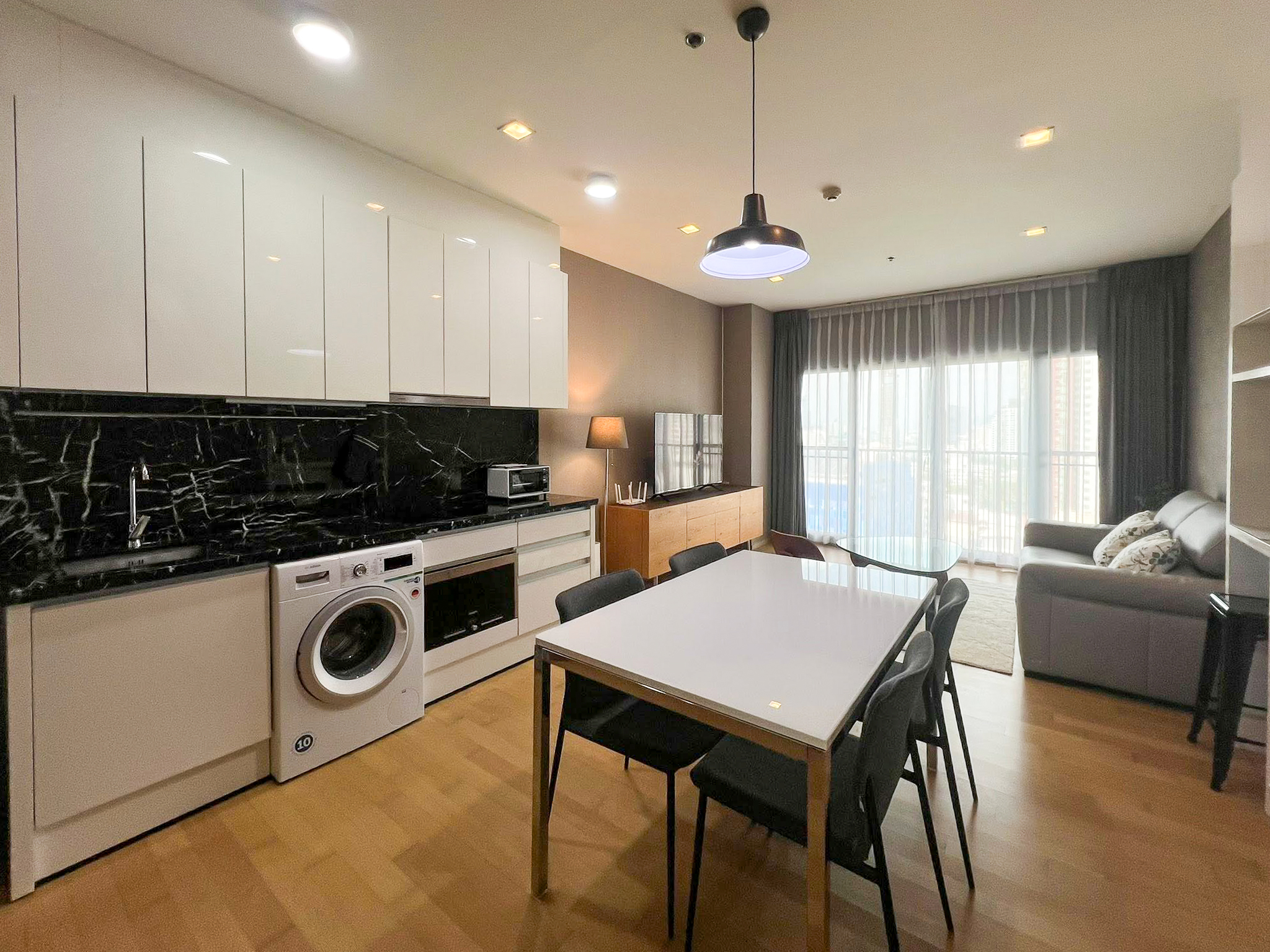 Spacious 2-bedroom, 2-bathroom condo for rent at Noble Reveal Ekkamai. Only 300m from BTS, fully furnished, 75 sqm, with indoor pool and gym. Rent: 60,000 THB/month.