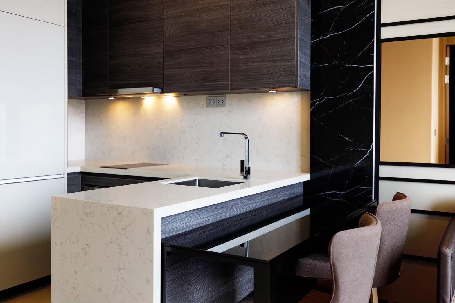 Rent this luxury 1-bedroom condo at The Esse Asoke, 32nd floor with skyline views, built-in furniture, and prime MRT/BTS access. Only 40,000 THB/month.