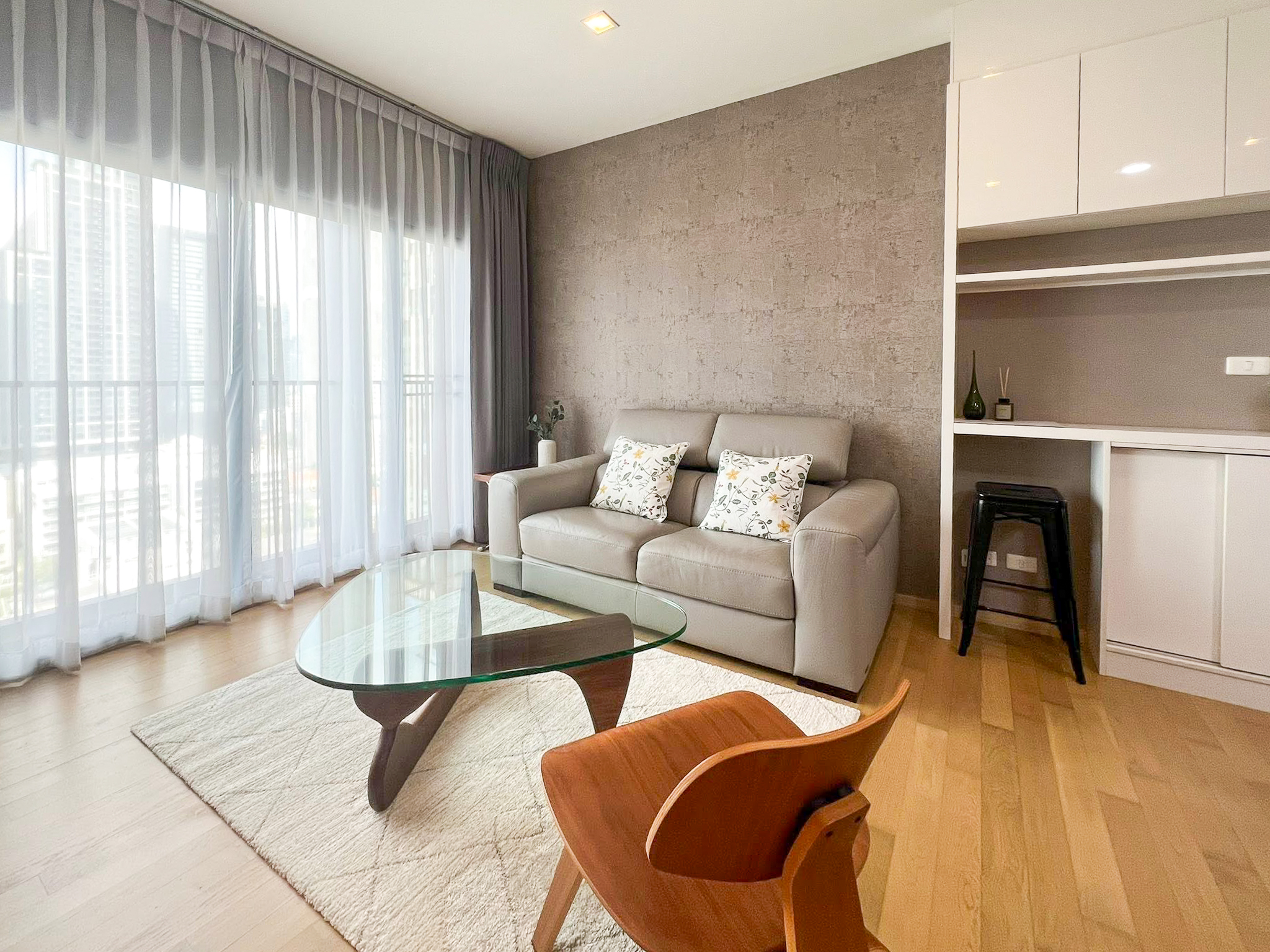 Spacious 2-bedroom, 2-bathroom condo for rent at Noble Reveal Ekkamai. Only 300m from BTS, fully furnished, 75 sqm, with indoor pool and gym. Rent: 60,000 THB/month.