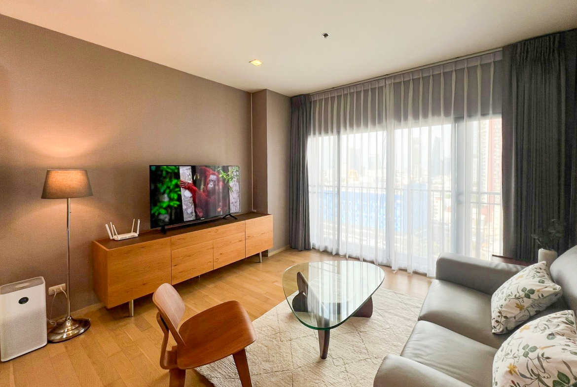 Spacious 2-bedroom, 2-bathroom condo for rent at Noble Reveal Ekkamai. Only 300m from BTS, fully furnished, 75 sqm, with indoor pool and gym. Rent: 60,000 THB/month.