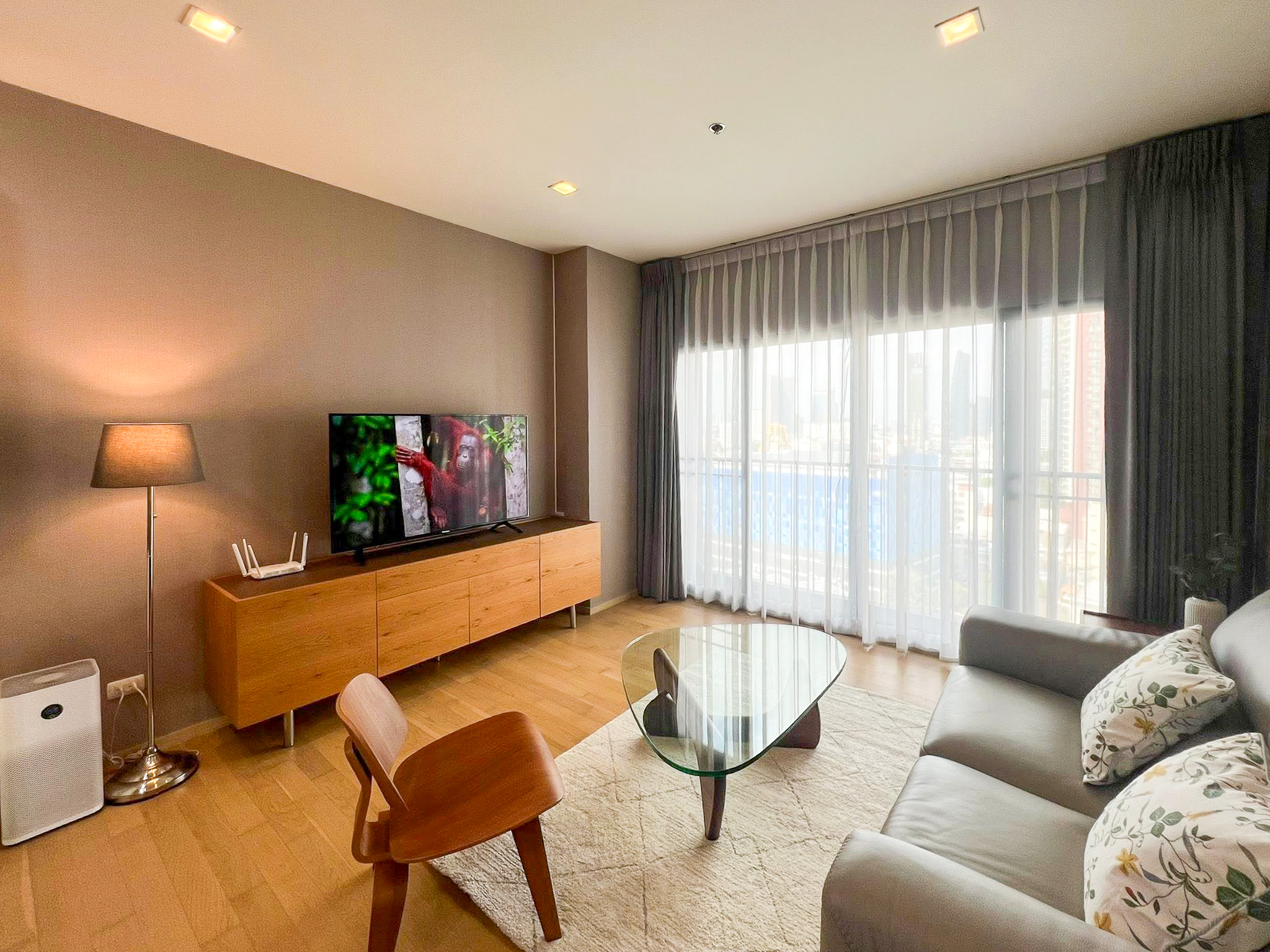 Spacious 2-bedroom, 2-bathroom condo for rent at Noble Reveal Ekkamai. Only 300m from BTS, fully furnished, 75 sqm, with indoor pool and gym. Rent: 60,000 THB/month.