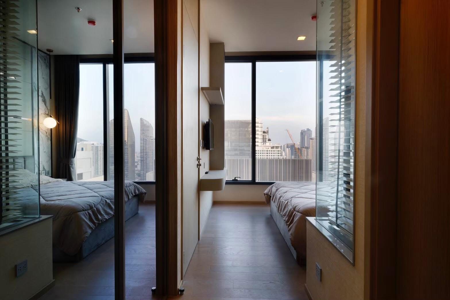 Rent this luxury 1-bedroom condo at The Esse Asoke, 32nd floor with skyline views, built-in furniture, and prime MRT/BTS access. Only 40,000 THB/month.