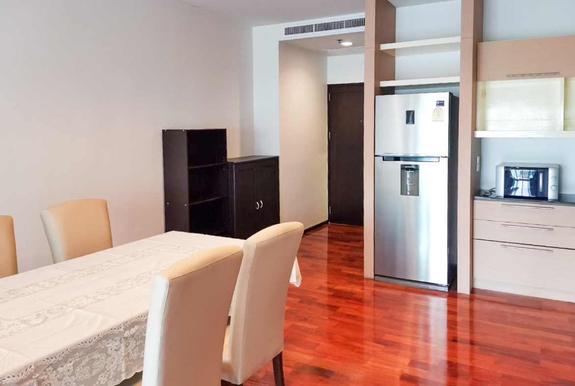 108 sqm 2-bedroom condo for rent on Sukhumvit 55. Fully furnished, high floor, modern kitchen, city view, 50,000 THB/month with full facilities.