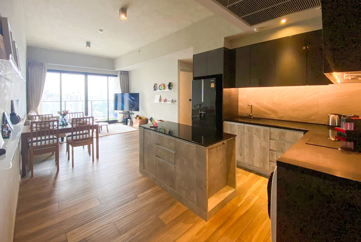 Rent this high-floor 2-bedroom condo at The Lofts Asoke with stunning city views, premium appliances, and luxury amenities. Prime Asoke location. 65,000 THB/month.