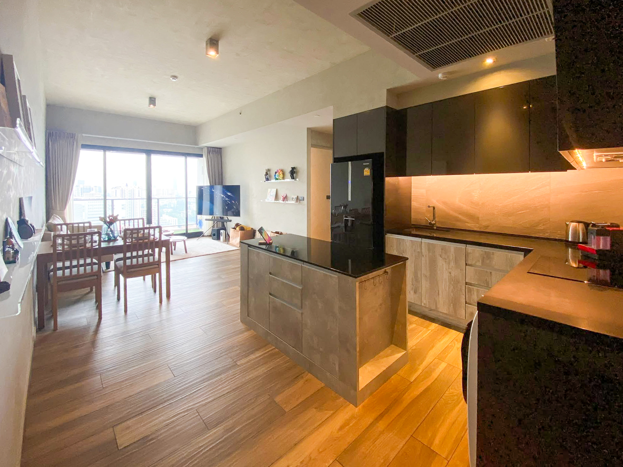 Rent this high-floor 2-bedroom condo at The Lofts Asoke with stunning city views, premium appliances, and luxury amenities. Prime Asoke location. 65,000 THB/month.