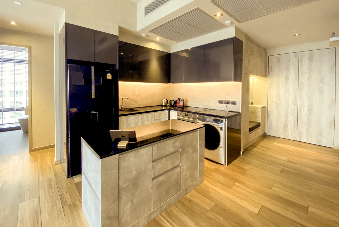Rent this high-floor 2-bedroom condo at The Lofts Asoke with stunning city views, premium appliances, and luxury amenities. Prime Asoke location. 65,000 THB/month.