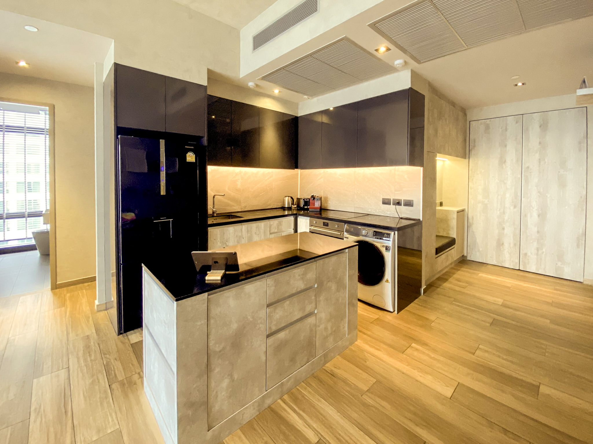 Rent this high-floor 2-bedroom condo at The Lofts Asoke with stunning city views, premium appliances, and luxury amenities. Prime Asoke location. 65,000 THB/month.