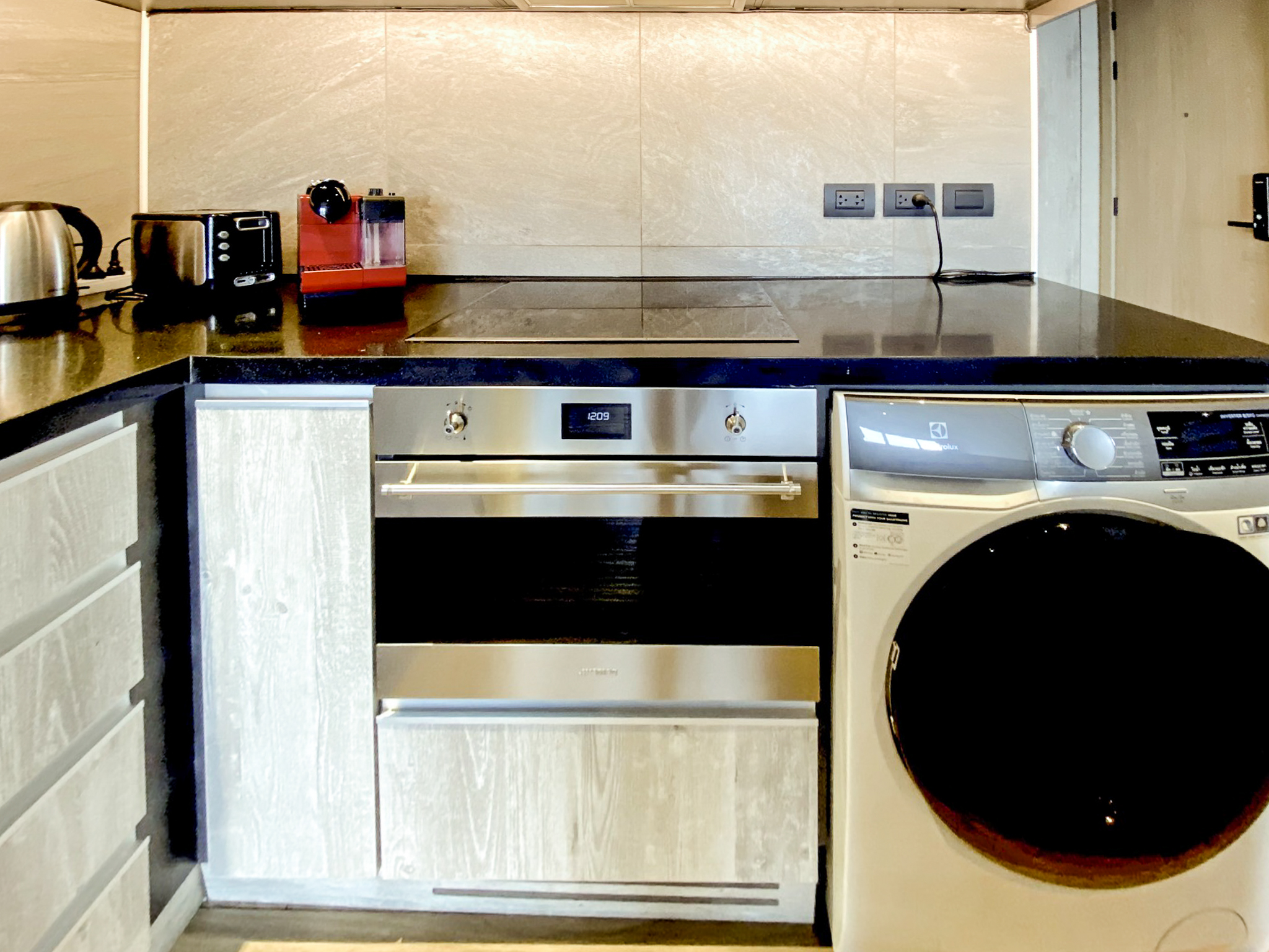 Rent this high-floor 2-bedroom condo at The Lofts Asoke with stunning city views, premium appliances, and luxury amenities. Prime Asoke location. 65,000 THB/month.